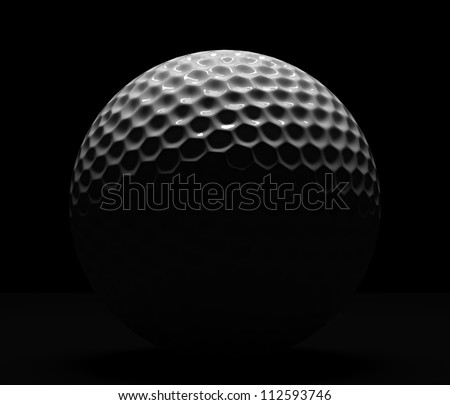 Isolated golf ball on dark background with illumination from top