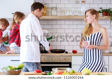 Picture of family with son and daughter in kitchen