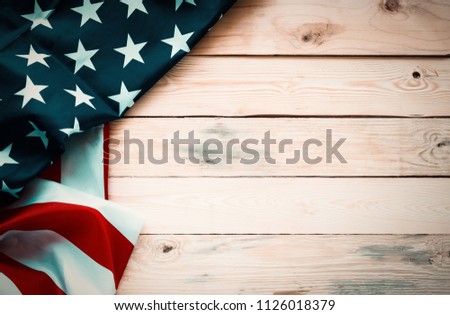 Vintage America flag waving pattern on wood table background top view in red blue white color concept for USA 4th july independence day, symbol of patriot freedom and democracy. pride in memorial day