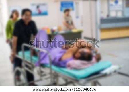 Blurred of medical team moving patient to see doctor in the hospital.
