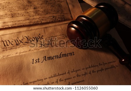 First Amendment and US Constitution text with legal gavel                                Royalty-Free Stock Photo #1126055060