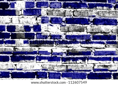 Greece flag painted on old brick wall