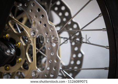 Close up shot of a motorcycle double disk front brake.