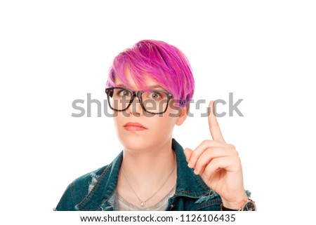 Attention, listen to me. Close up portrait of young woman wagging her index finger pointing up isolated white background. Negative human emotions face expression life perception body language attitude