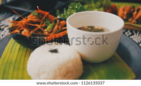 Stir Fried Shrimp with Chili Paste (Thai Food). Eat with Jasmine Rice, Soup on banana leaf. Decorated Thai food set.