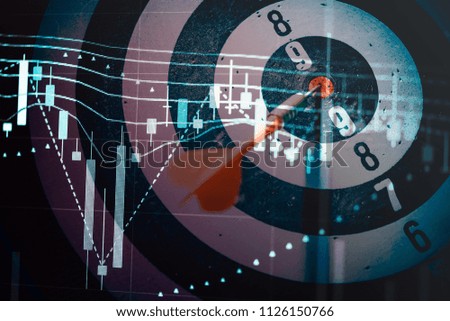 Close up shot of the dart arrow hit on bull eyes of dartboard to represent that the business reached the target of company with dark tone picture style. Target and goal as concept.