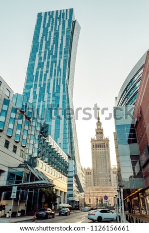 view of the Palace of Culture and Arts in the background of a skyscraper in Warsaw Poland