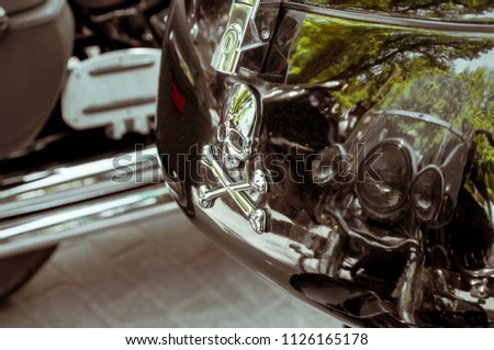 trunk of a motorcycle with the sign of the skull