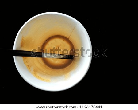 Coffee cup made of paper placed on the wood painted white. Empty paper cup of Coffee with flat drinking straws.