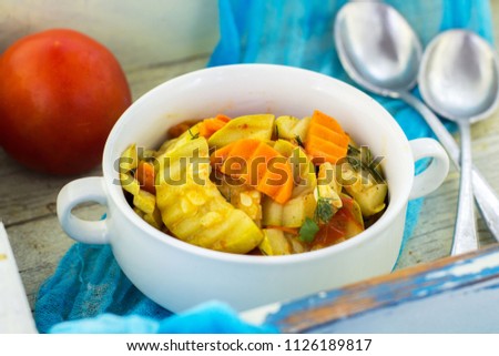 Stew of zucchini on white background