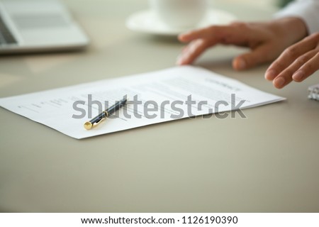 Offering to sign contract concept, businesswoman proposing reading terms conditions of business paper deal, legal sale purchase document for bank loan, insurance services or employment close up view Royalty-Free Stock Photo #1126190390