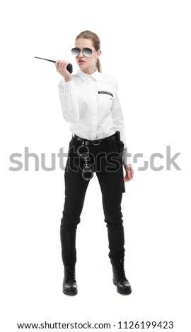 Female security guard using portable radio transmitter on white background