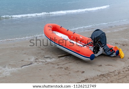 lifeboat on the beach Royalty-Free Stock Photo #1126212749