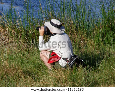 Man taking nature photos while on a hike
