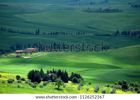 Dreaming colors of green spring landscape of Tuscany, Italy. Royalty-Free Stock Photo #1126252367