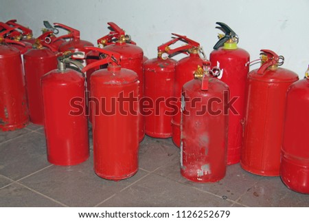 many red fire extinguishers