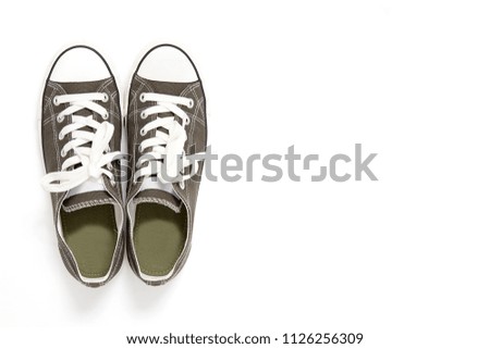Pair of new green , gray sneakers isolated on white background.