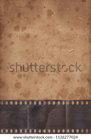 Vintage background with aged retro paper and old film strip