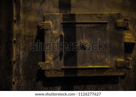Steel wall with hatches on industrial equipment for metallurgy.
