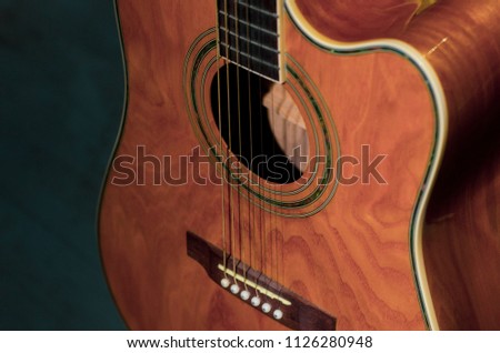 details of acoustic guitars are photographed close