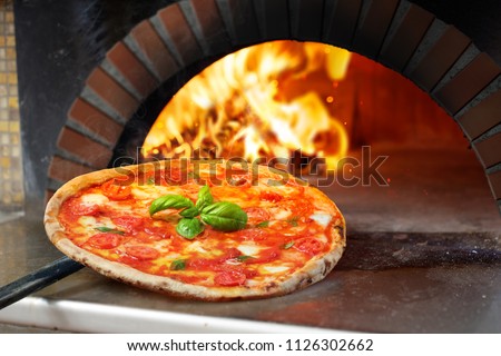 Hot Margherita Pizza baked In Oven
 Royalty-Free Stock Photo #1126302662