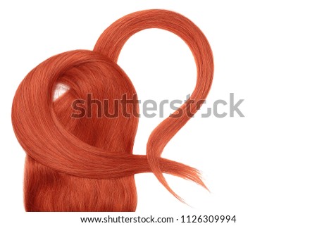 Red hair in shape of heart, isolated over white