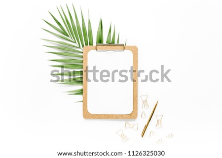 Mockup with clipboard, palm leaf, clips. Flat lay, top view