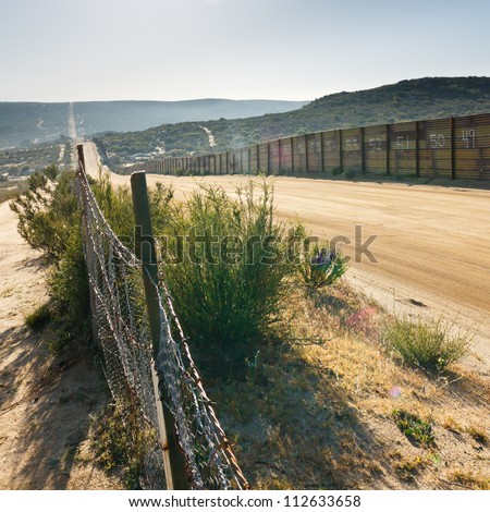 US/Mexico border fence near Campo, California, USA Royalty-Free Stock Photo #112633658
