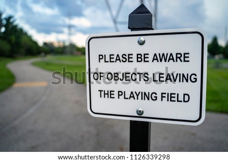Please Be Aware of Objects Leaving the Field Sign