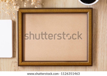 Top view of template white frame mock up with copy space, decorated with flower, wooden camera, black coffee, clock and note book for wedding concept