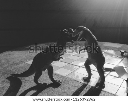 Tyrannosauras on marble table.