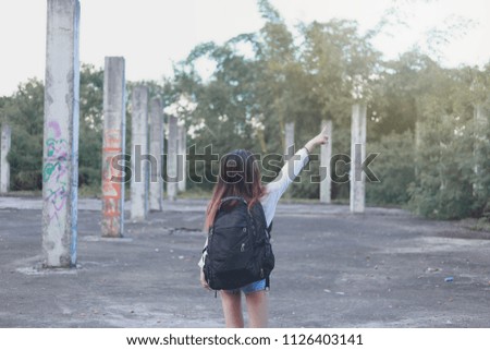 Woman backpacker traveling with backpack 