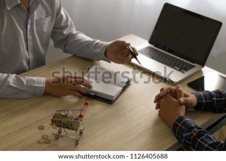 Businessman using laptop to teach and  analysis the situation on the market value , Business concept 