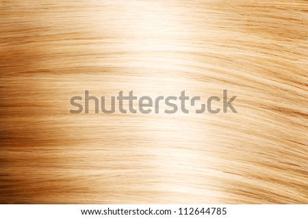 Blonde Hair. Blond Hair Texture, close-up. Beautiful healthy long curly blonde hair close-up texture. Dyed smooth white hair background, coloring, extensions, cure, treatment concept