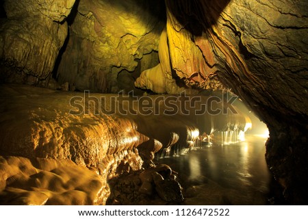 Nam Talu Cave  or Through Water Cave is a long cave with water streaming through in Khao Sok National Park : Surat Thani Province, Thailand.
