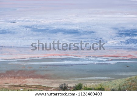 Salty lake with patterns similar to the surface of Mars, Saturn, Earth or other planets from outer space
