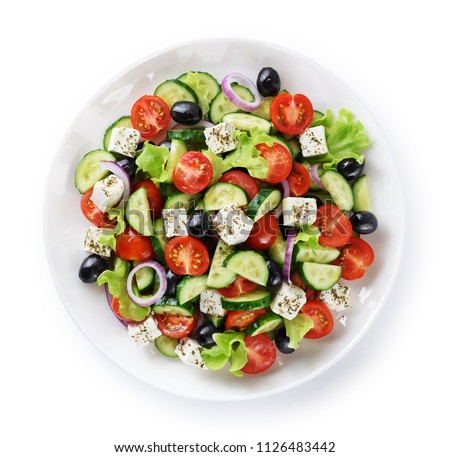 Salad with cheese and fresh vegetables isolated on white background. Greek salad. With clipping path.