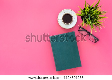 Reading for study and work. Self-education concept. business literature. Books with empty cover near glasses, coffe, plant on pink desk top view copy space