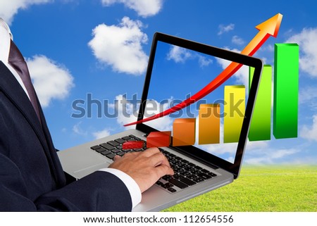 businessman working with laptop and Growth Colorful Bar Diagram