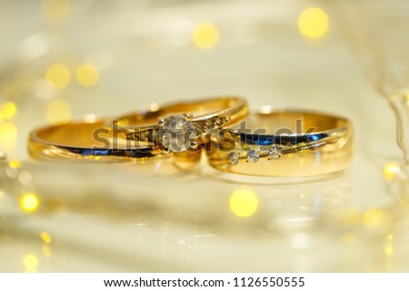 Golden wedding rings in the sunlight