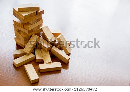 Problem Solving Business can't stop effect of dominoes continuous toppled with business team feeling sad and stress in office background. Failure Business Concept. Royalty-Free Stock Photo #1126598492