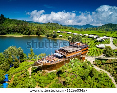 Aerial View of a Pinisi Boat Shaped Restaurant Building in the Edge of a Cape of Lake Patenggang, Ciwidey, Bandung, West Java, Indonesia, Asia Royalty-Free Stock Photo #1126603457