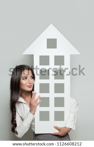 Real estate insurance, protection and property for sale concept. Smiling business woman showing house banner background