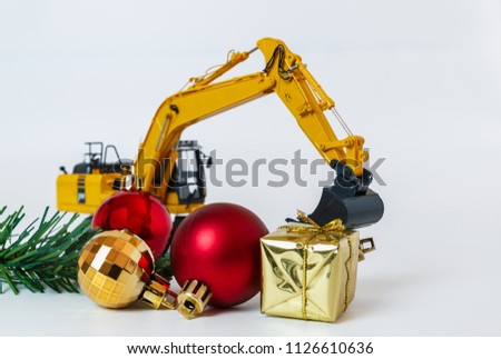 Christmas ornament and Excavator model ,  Holiday celebration concept new year on white background