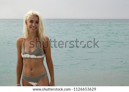 Happy young woman on the beach