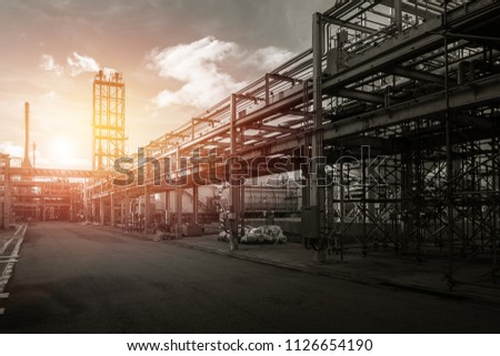 Pipeline and pipe rack of industrial plant with sunset sky background, Manufacturing of industrial plant with monotone Royalty-Free Stock Photo #1126654190