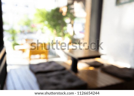 Pixelation effect of Coffee shop blur background with bokeh image, using as a background or wallpaper
