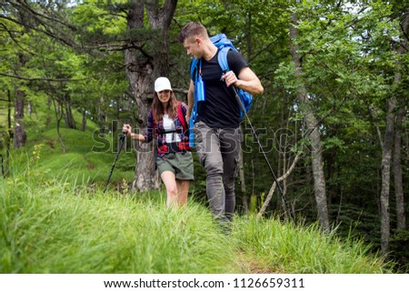 Couple enjoying on their hiking trip.Travel and adventure concept