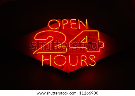 Open 24 Hours neon sign on a restaurant