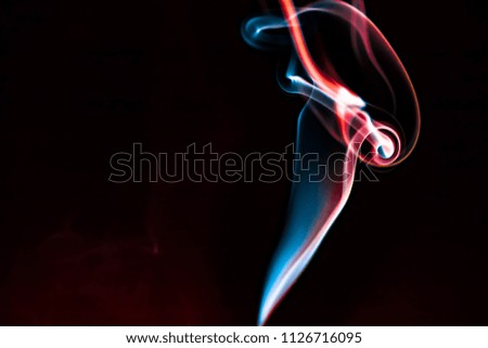Movement of Smoke abstract background, colorful smoke of wonderful magic isolated on dark at night
